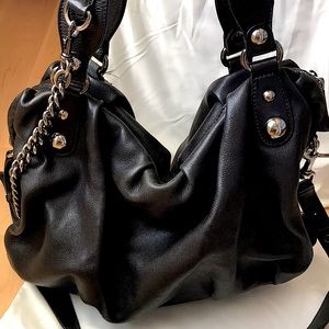 A classic, gorgeous Gucci Large Black Leather Bag and rare suede black interior.
